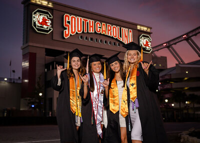 A group of University of South Carolina students, celebrating their graduation at their senior portrait session with their senior photographer, Lyndsey Livingston