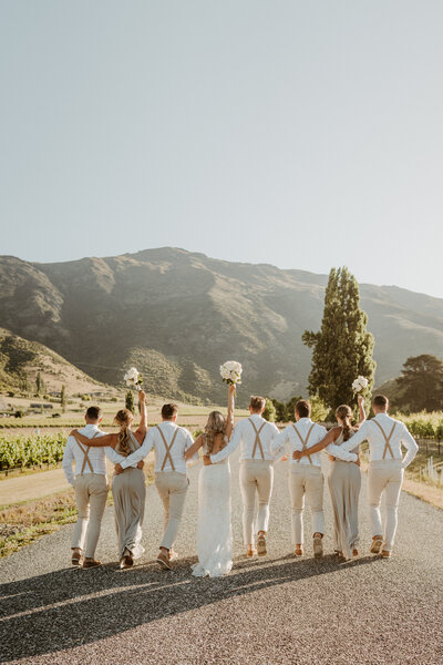 Bridal-party-celebrating-in-queenstown-mountains