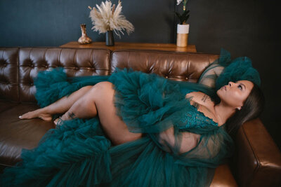Boudoir portrait o woman wearing luxurious green robe