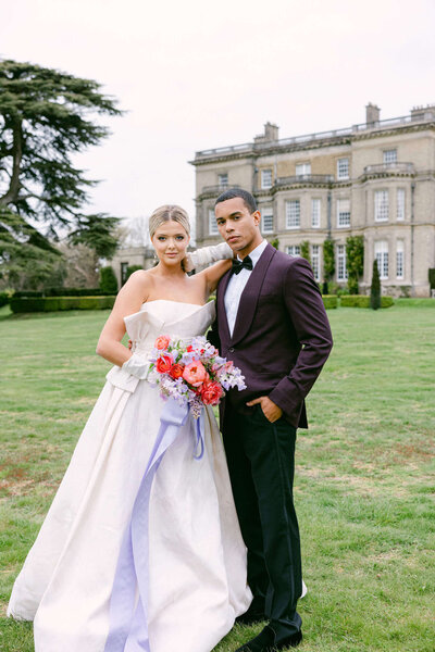 A wedding photo of the bride and groom at Hedsor house in the UK