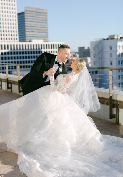 bride and groom dancing on a rooftop in New Orleans