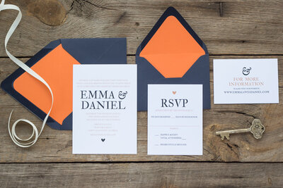 wedding invitations with envelope liners in navy and orange