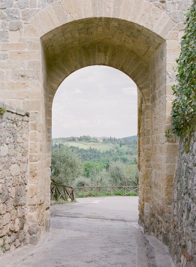rolling hills stone arch in tuscany italy print photo
