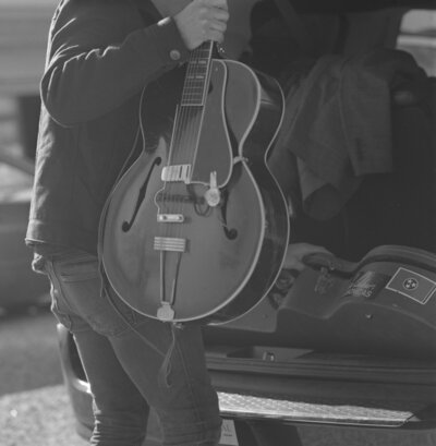 Bass guitar being put into a truck on 120mm film.