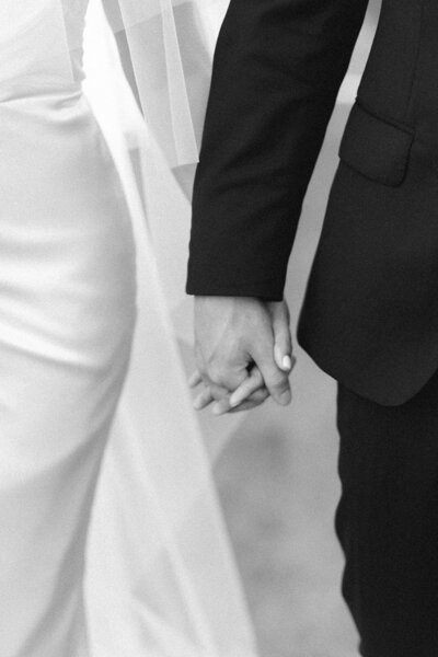 Close-up of a couple's clasped hands.