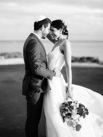 Groom breaking the glass under the chuppah during a Jewish wedding at Casa de Campo, captured by Asia Pimentel.