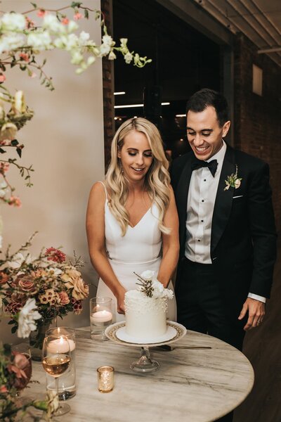 Wedding couple cutting their cake at Venue308 in Calgary
