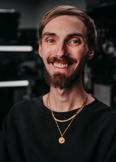 A person smiling large