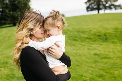 a mother and daughter hugging during a family lifestyle shoot