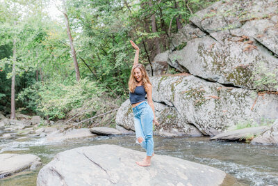 Picture of Nicole Marie Photography posing on a boulder in Pennsylvania.