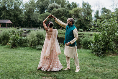 Groom twirls his bride before their Nikkah ceremony