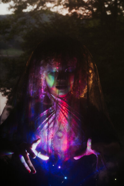 A girl holds a spell in her hand.