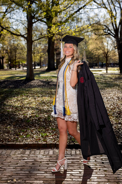 A University of South Carolina student taking his senior portraits on campus
