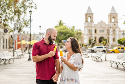 couple eating popsicles in downtown Cabo San Juan