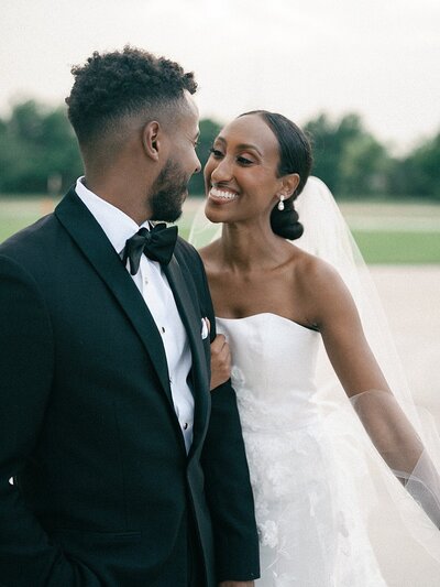 Bride and groom walk up memorial steps at their DC wedding