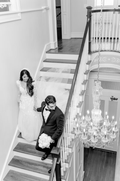 Bride and groom walk up memorial steps at their DC wedding