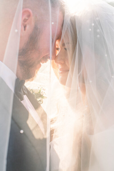 wedding in bozeman montana using the veil for the portrait