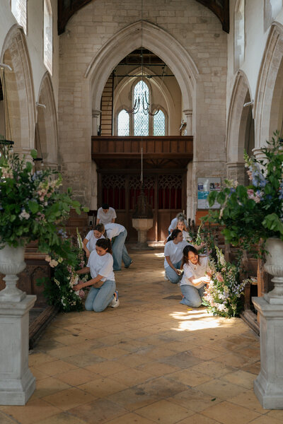 Churh ceremony with rambling meadow arrangements 