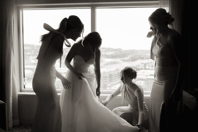 Bride and guests on dance floor at Paris destination wedding, moody cinematic Super 8