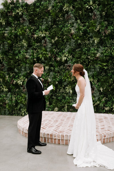 Couple in wedding attire celebrating before walking back down the aisle