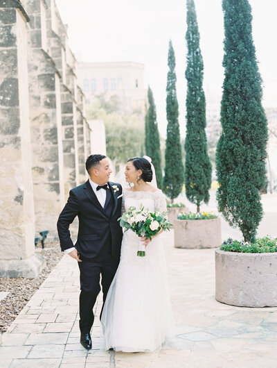 Bride and Groom take each other's hand during a romantic first look