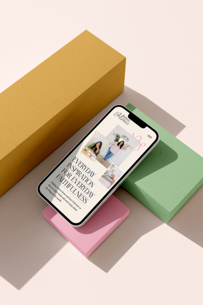 iPhone mockup of Marissa Martinez website on top of colorful blocks