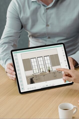 Screenshot of the Design Appy interface showing a room layout with material selections and elevation notes on an iPad, helping users visually organize their home design projects.