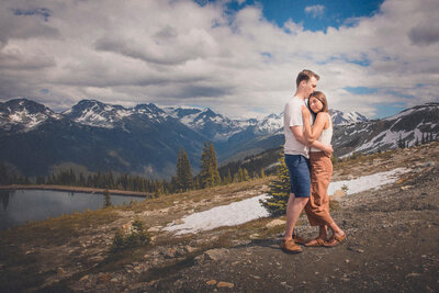 Couple standing on a mountainside