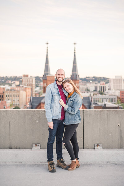 couple standing on a rooftop