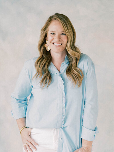 South Carolina Wedding Photographer | Photographer with red hair wearing blue shirt in studio