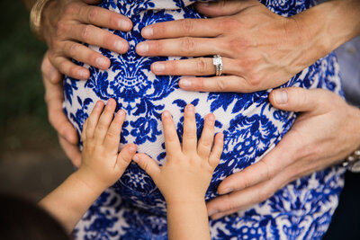 hands on mothers belly during maternity photo session by Raleigh Maternity Photographer Caroline Merrill