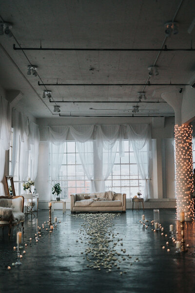 wedding venue with flower petals and candles