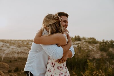 couple hugging on beach