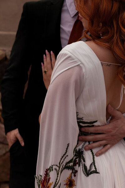 Close-up of couple hugging during their intimate Utah elopement, captured by Lamblight Photography