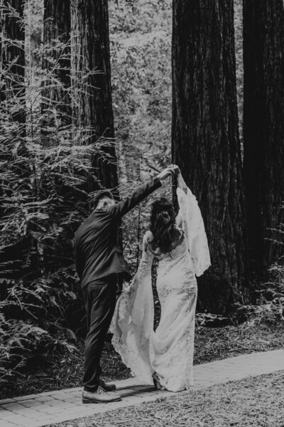 bride and groom dance in forest