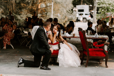A bride and her dad share a quiet moment during her wedding day.