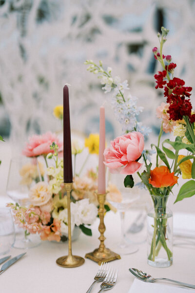 Elegant wedding reception setup with pastel flowers and candles, photographed by Toronto wedding photographer