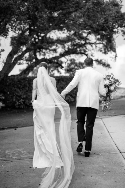 Bride and groom walk up memorial steps at their DC wedding