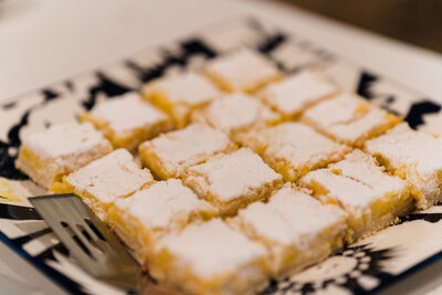 lemon bars sitting on a plate