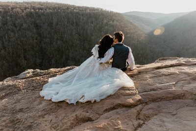 Intimate vows at sunrise at whitaker point, also known as hawksbill crag.