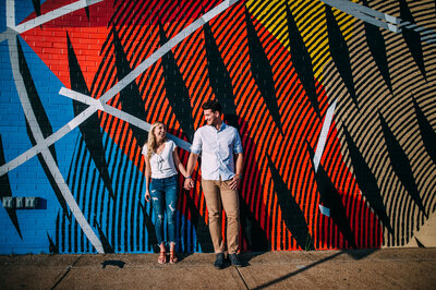 engaged couple at graffiti wall in st louis