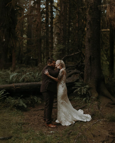 An eloping couple having their ceremony in the Hoh Rainforest.