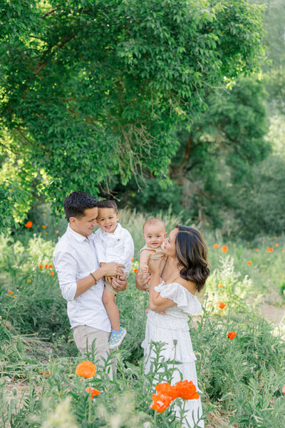 family snuggling and smiling