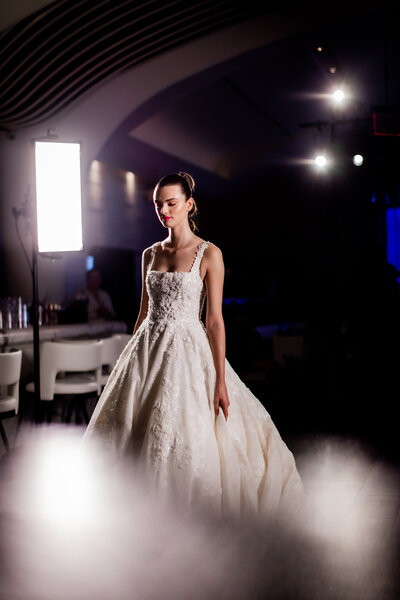 Runway image of a model wearing designer bridal gown