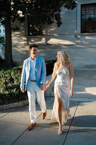 Bride and groom walk up memorial steps at their DC wedding