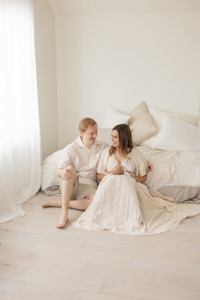 mom and dad holding their newborn | Heather Parrish Photography