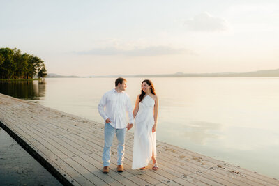 a couple during their engagement photos at american lake, photography by seattle wedding photographer sarah mismash