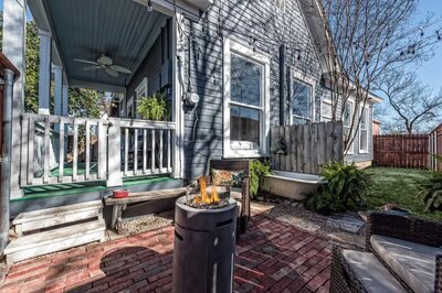 a large covered deck, and small yard complete with patio at this 2-bedroom 2-bathroom vacation rental home on the Baylor University campus in Waco, TX