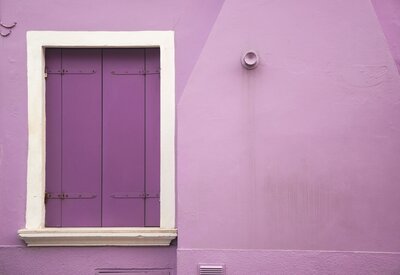 a purple door against a lighter purple building for youtube editing on socialfizz