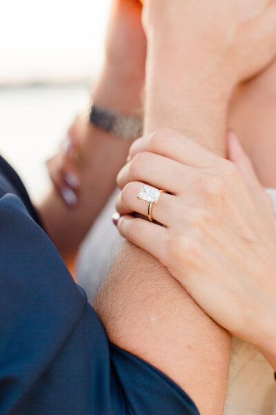 Orlando couples photographer captures a close up image of a newly engaged couples ring